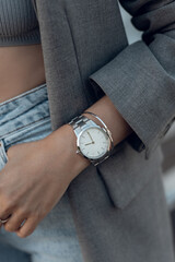 Wall Mural - Beautiful stylish white watch on woman hand