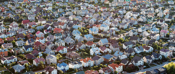 settlement with many houses in a small town, photographed from above. wide angle panoramic photo wit