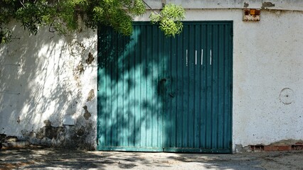 sidewalk with door of garage in rustic facade