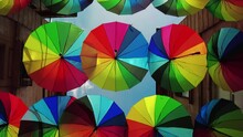 Low Angle Shot Of Colorful Umbrellas Hanging A Long The Street