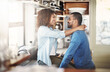 © Lyndon S/peopleimages.com - Young, in love and happy couple talking, hugging and having fun in a kitchen at home. Lovers embracing, enjoying time together while bonding. Partners being affectionate and having a romantic moment