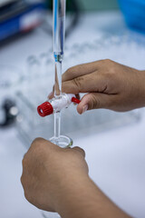 Poster - Scientist working Titration technique in the laboratory.