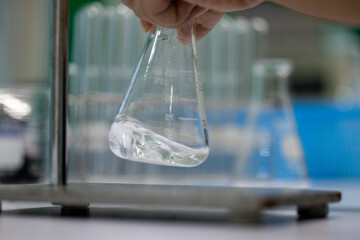 Poster - Scientist working Titration technique in the laboratory.