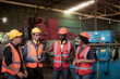 © pornchai - group of diversity teamwork engineers, technician, foreman and workers in safety uniform are happy morning talk and putting hands up to starting work in heavy industrial manufacturer factory.