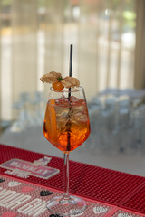 Wall Mural - Spritz Cocktail in glasses with ice and orange slice on light  background.