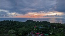 Aerial Hyperlapse Of Quepos City In Costa Rica With Orange Sky. 4k Videos. Playa Quepos Beach On The Vibrant And Tropical Peninsula Of El Cocal.