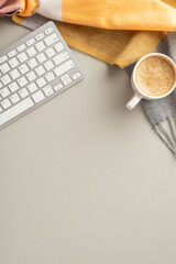 autumn business concept. top view vertical photo of workplace keyboard cup of frothy hot drinking an