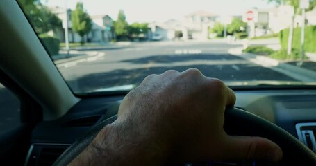 Sticker - Closeup of human hand holding wheel during drive