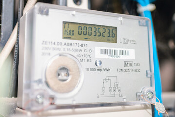 Smart electric power meter counter measuring power usage.Close-up of modern smart grid residential digital power supply meter.Indoors shot.Selective focus.