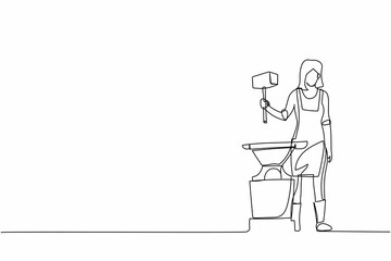 Wall Mural - Continuous one line drawing female blacksmith wearing apron standing and holding hammer in front of the anvil. Metal worker making craft art production. Single line design vector graphic illustration