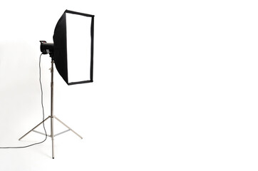 Studio lighting equipment sides softboxe on tripod stands. Modern photo studio on white background.