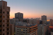 Balcony view of generic apartment buildings in the residential neighborhood of Al Qasimia in Sharjah, United Arab Emirates. Urban scene at sunrise.