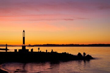 Wall Mural - Garry Point Early Morning Fishing Richmond. Anglers out at dawn in Steveston, British Columbia, Canada. 

