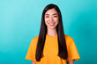 Photo of girlish cheerful nice woman straight hairdo wear yellow t-shirt smiling look at camera isolated on turquoise color background