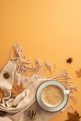 Wall Mural - Autumn inspiration concept. Top view vertical photo of cup of frothy cocoa on saucer anise yellow maple leaves scarf and pine cones on isolated orange background