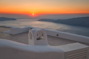Wall Mural - Amazing sunset on Santorini, scenic view of the typical white architecture with caldera view, outdoor travel background, Imerovigli, Santorini island, Greece