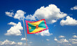 Grenada national flag cloth fabric waving on the sky - Image