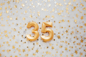 Wall Mural - Number 35 thirty five golden celebration birthday candle on Festive Background. thirty five years birthday. concept of celebrating birthday, anniversary, important date, holiday
