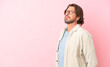 © luismolinero - Senior dutch man isolated on pink background looking to the side
