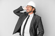 © luismolinero - Young architect man with helmet over isolated background thinking an idea