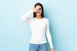 © luismolinero - Young caucasian woman isolated on blue background covering eyes by hands and smiling