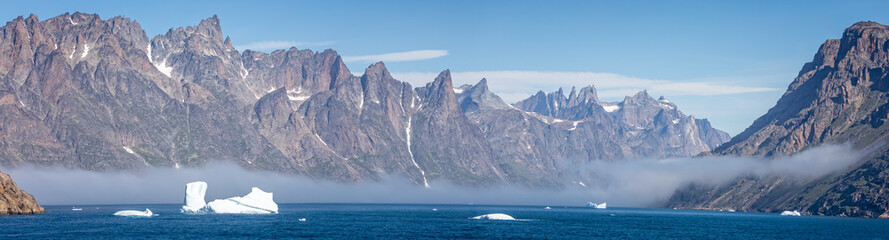 Wall Mural - Panoramic landacpe of icebergs and mountains in Prince Christian Sound, South Greenland