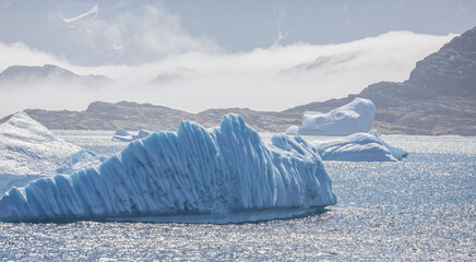 Wall Mural - landscape of large icebergs and mountains in Prince Christian Sound, South Greenland