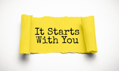 Wall Mural - IT STARTS WITH YOU. words. text on yellow paper on torn paper background