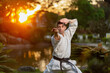 Karate black belt man performing kata outdoors
