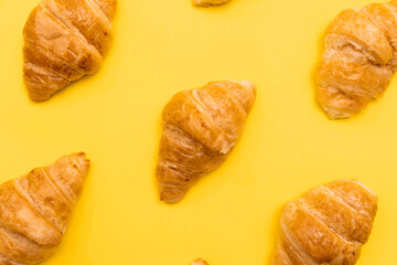 Croissants Patterned On Yellow Surface