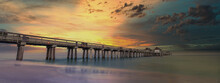 Florida City Of Naples Pier During Beautiful Sunset After Warm Sunny Day, Beach Architecture Of Pier Above The Sea With Awesome Colourful Setting Sun Background. Travel Concept.