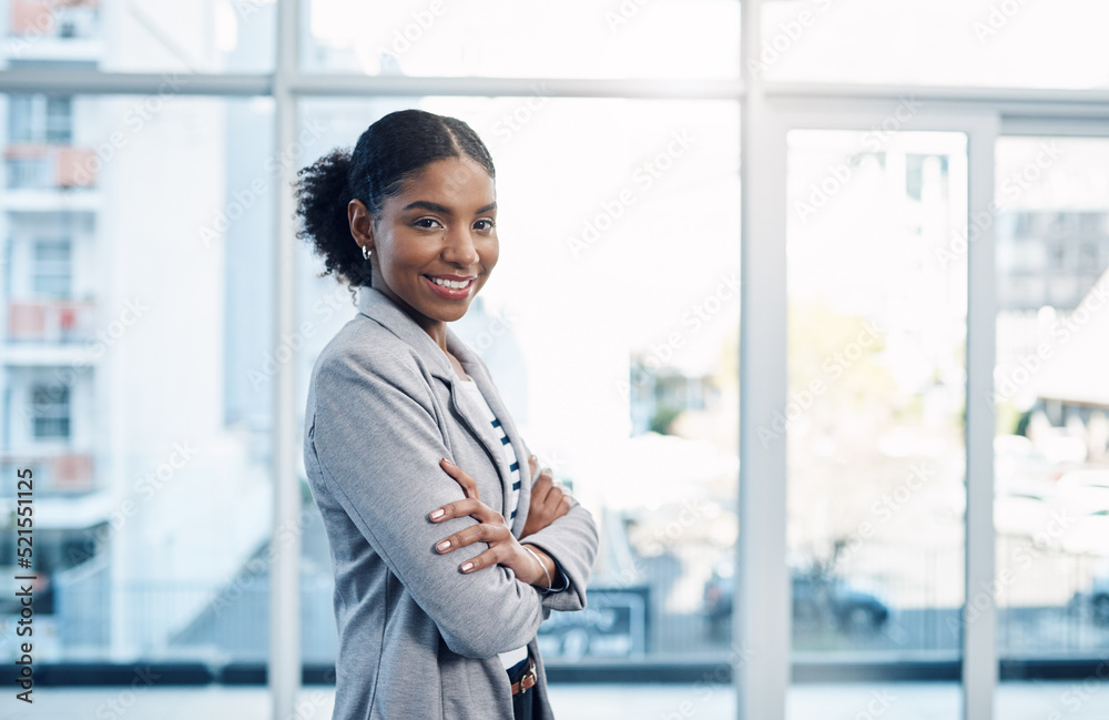 Confident, happy and ambitious woman with standing with her arms ...