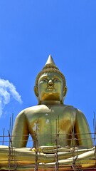 Wall Mural - Buddha image of Luang Por Sothon, Wat Bosoth, on August 4, 2022, at Wat Bosoth, Sam Khok, Pathum Thani Province. Vertical image from the front