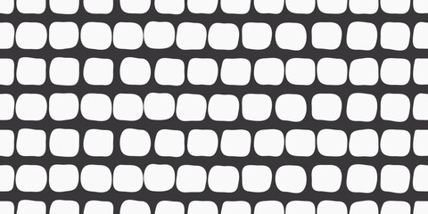 Poster - 
White uneven pads on a black background. Decorative pattern seamless and stylish of white rounded shapes.