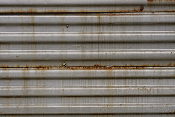 Wall Mural - metal texture of an old gray striped iron wall in brown rust