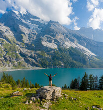 Aerial View Of A Person Standing In Front Of Oeschinensee Lake, Bern, Switzerland.