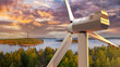 Offshore wind generators. White wind turbine over forest. Generation environmentally friendly electricity. Windmills next to river. Giant wind turbines over lake. Eco-friendly electricity. 3d image