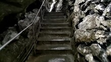 Moving Forward Through A Cave With Masonry And Stairs