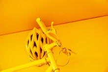 A Fragment Of A Bicycle And A Helmet Painted Yellow. Using Old, Unnecessary Items To Decorate The Room. Selective Focus