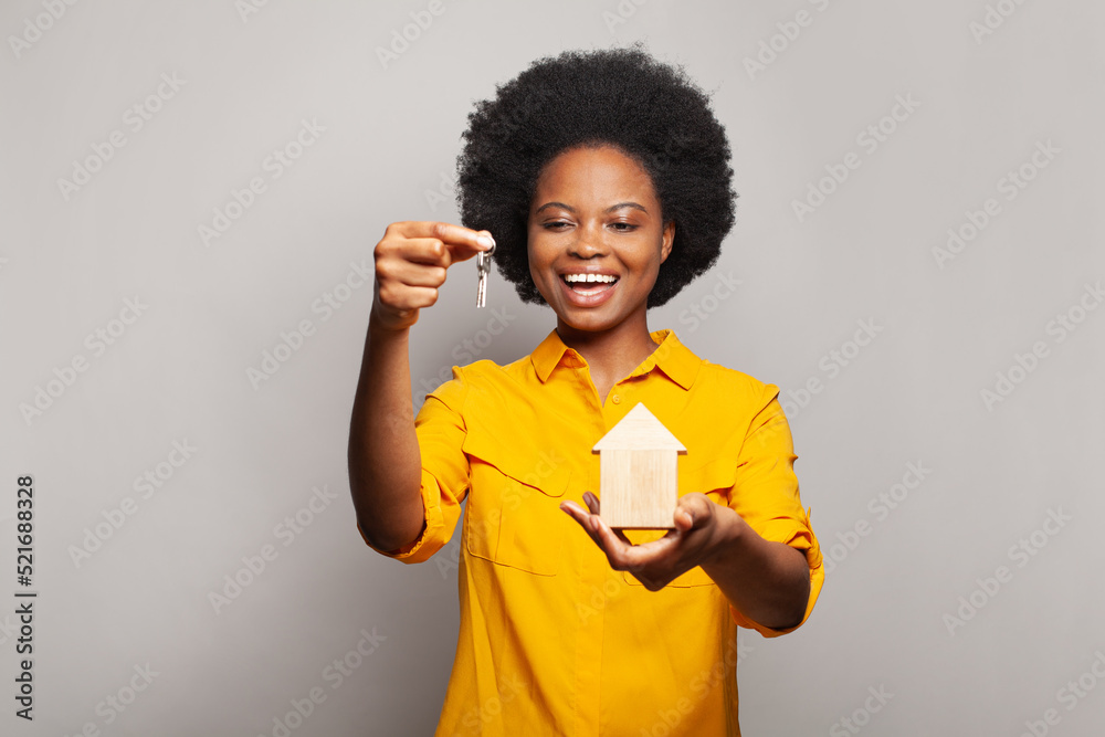 Happy black woman holding keys from her new home Stock Photo | Adobe Stock
