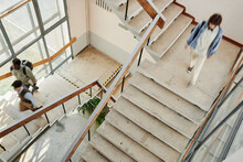 Students Of Modern University Or Other Highschool Moving Along Staircases While Leaving For Home Or Going To Auditorium