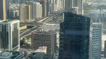 Wall Mural - Aerial high view of Abu Dhabi city (UAE) from downtown, Abu Dhabi corniche road and beach