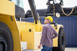 © JU.STOCKER - Foreman in hardhat helmet control loading containers box from cargo, Engineer checking and inspect container in industry cargo