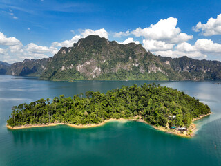 Wall Mural - Aerial drone view of Frog island, tropical Mountain peak on the lake, Khao Sok National Park, Thailand