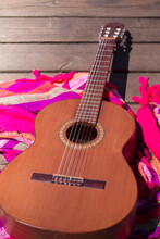 Music Lifestyle. Guitar On Wooden Boards And Pink Textile On A Bridge. Outdoors. 