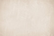 © Manitchaya - Old concrete wall texture background. Close up retro plain beige color cement material surface