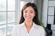 © Kiattisak - Attractive Asian businesswoman smiling confidence standing and looking at camera in office.