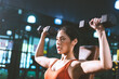© chokniti - young Asian woman person exercise in fitness gym for building a beautiful slim body, healthy training of athletic female in sport lifestyle, attractive girl doing weight active wellness in happy