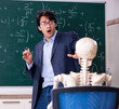 Young male math teacher and student skeleton