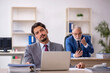 © Elnur - Two male colleagues working in the office